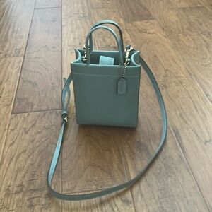 Small green coach cross body bag